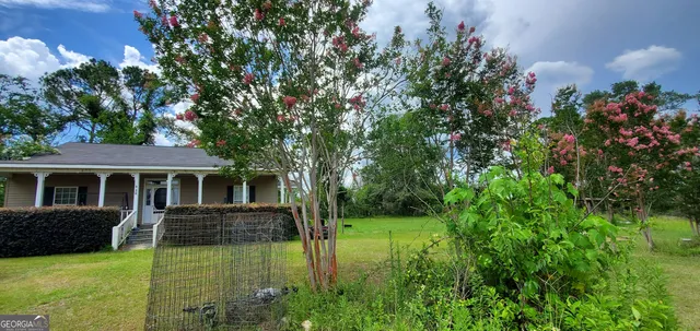 a view of outdoor space and yard