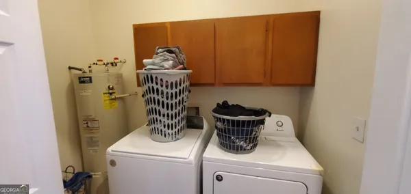 a utility room with dryer and washer