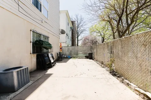 a view of a backyard of the house