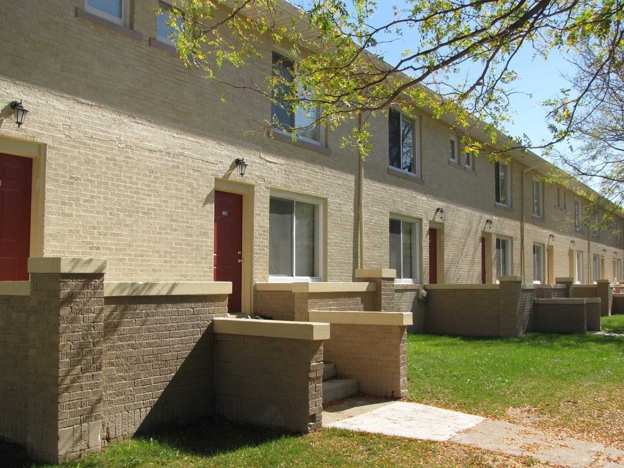 a view of house with backyard and outdoor seating