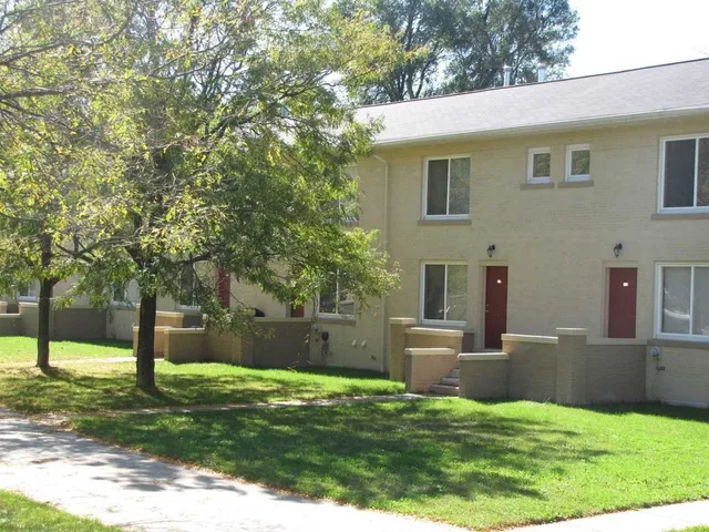 a view of a house with a backyard