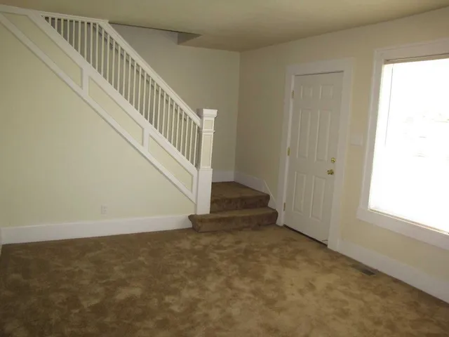 a view of an entryway with staircase