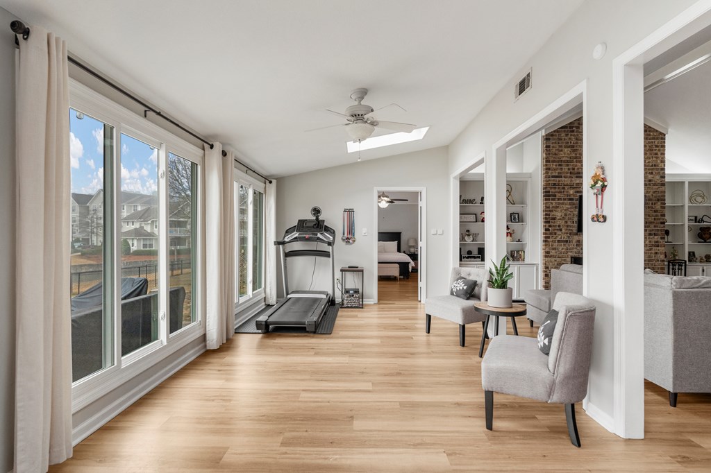 6831 Beaver Trail Midland, GA 31820 - Photo 8 of 24 a living room with furniture large windows and wooden floor