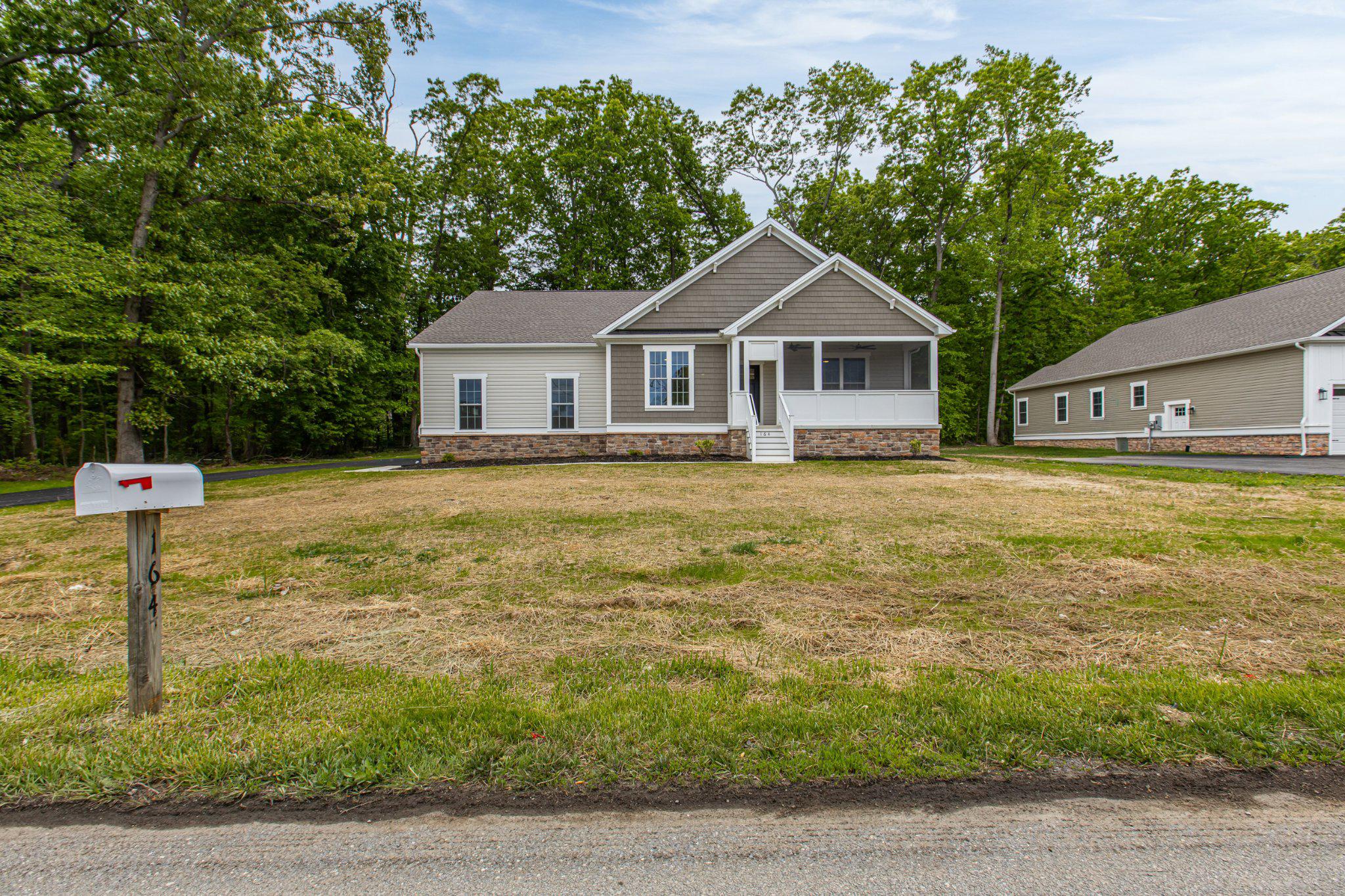 164 Pine Tree Road Townsend, DE 19734 - Photo 6 of 84 a front view of a house with a yard