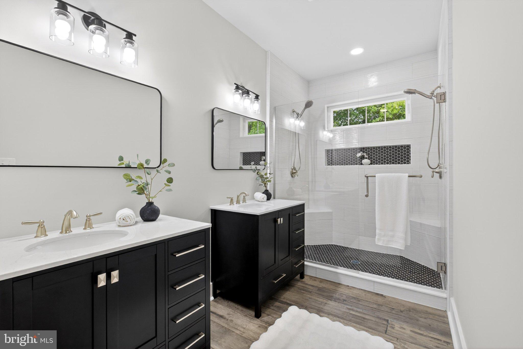 164 Pine Tree Road Townsend, DE 19734 - Photo 62 of 84 a bathroom with a double vanity sink mirror and shower