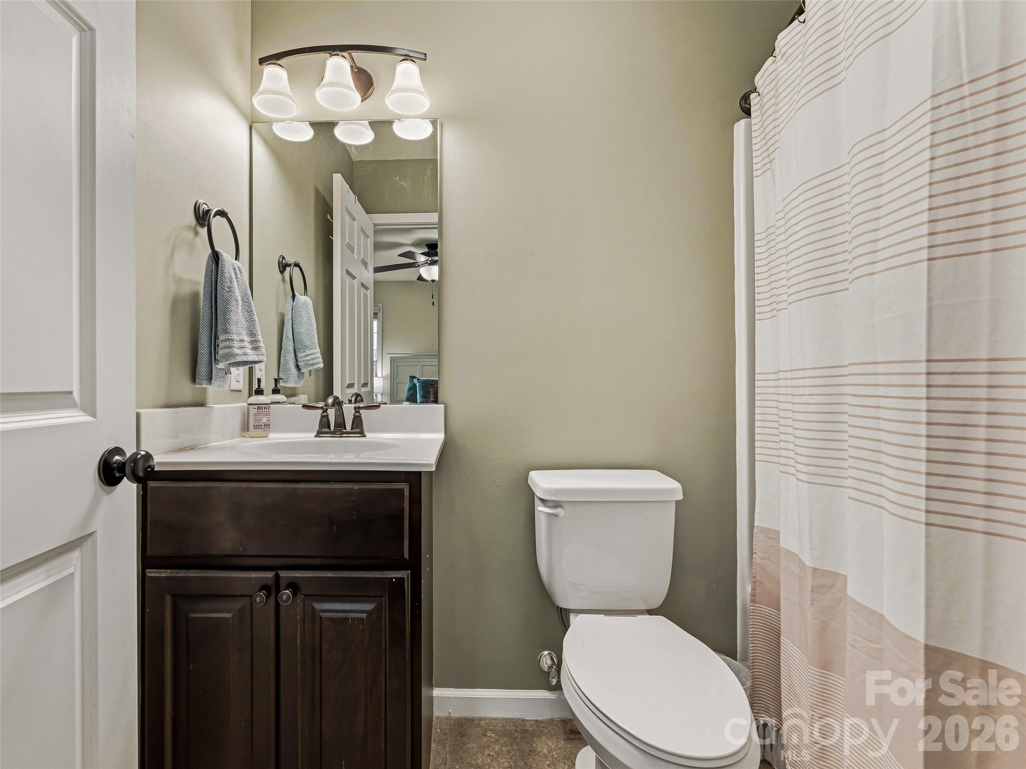 21 Yarrow Meadow Road Weaverville, NC 28787 - Photo 15 of 38 a bathroom with a toilet sink and mirror