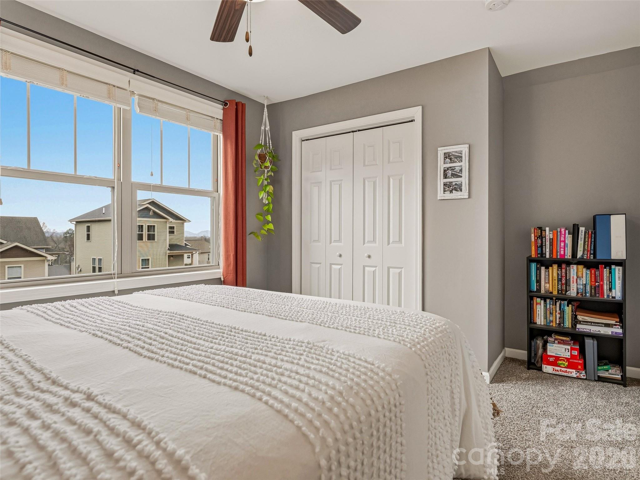 21 Yarrow Meadow Road Weaverville, NC 28787 - Photo 21 of 38 a bedroom with a bed and a large cabinets