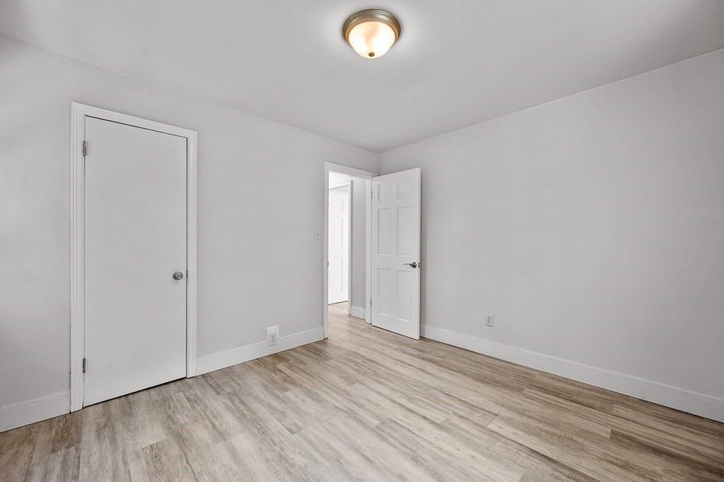 10 Maplewood Road Worcester, MA 01602 - Photo 14 of 24 a view of an empty room and wooden floor