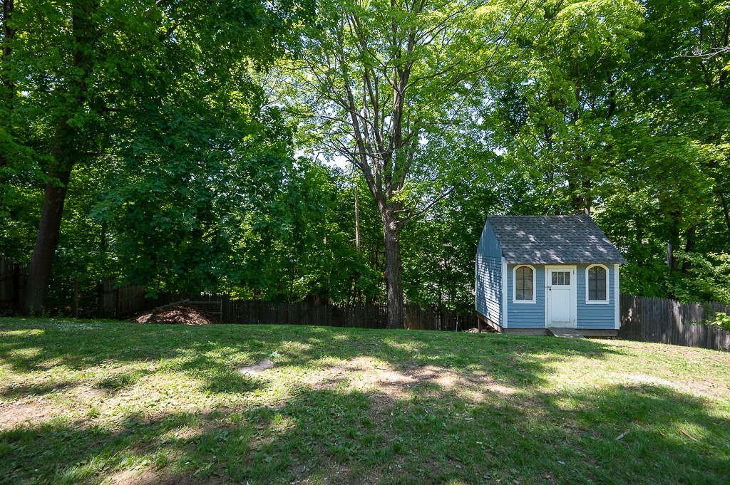 10 Maplewood Road Worcester, MA 01602 - Photo 24 of 24 a backyard of a house with plants and large tree