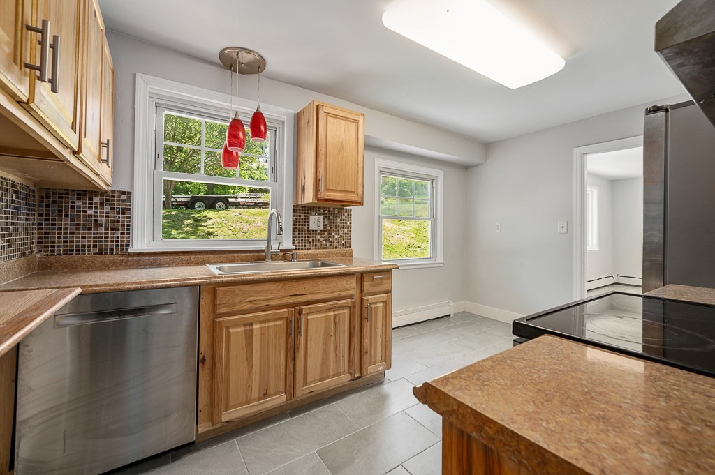 10 Maplewood Road Worcester, MA 01602 - Photo 9 of 24 a kitchen that has a sink and a stove