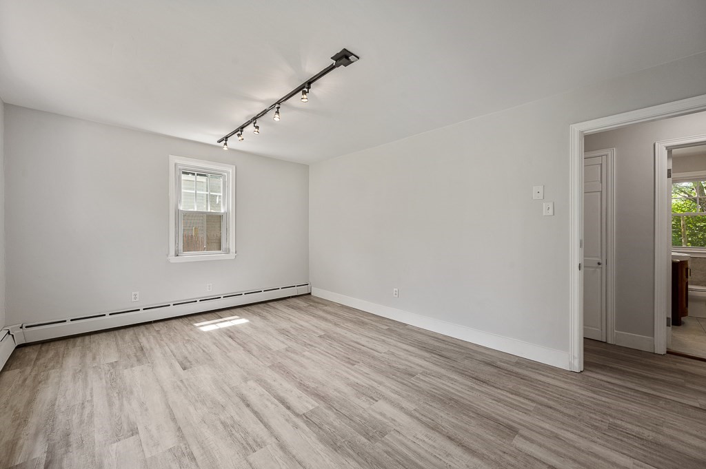 10 Maplewood Road Worcester, MA 01602 - Photo 10 of 24 an empty room with wooden floor and windows
