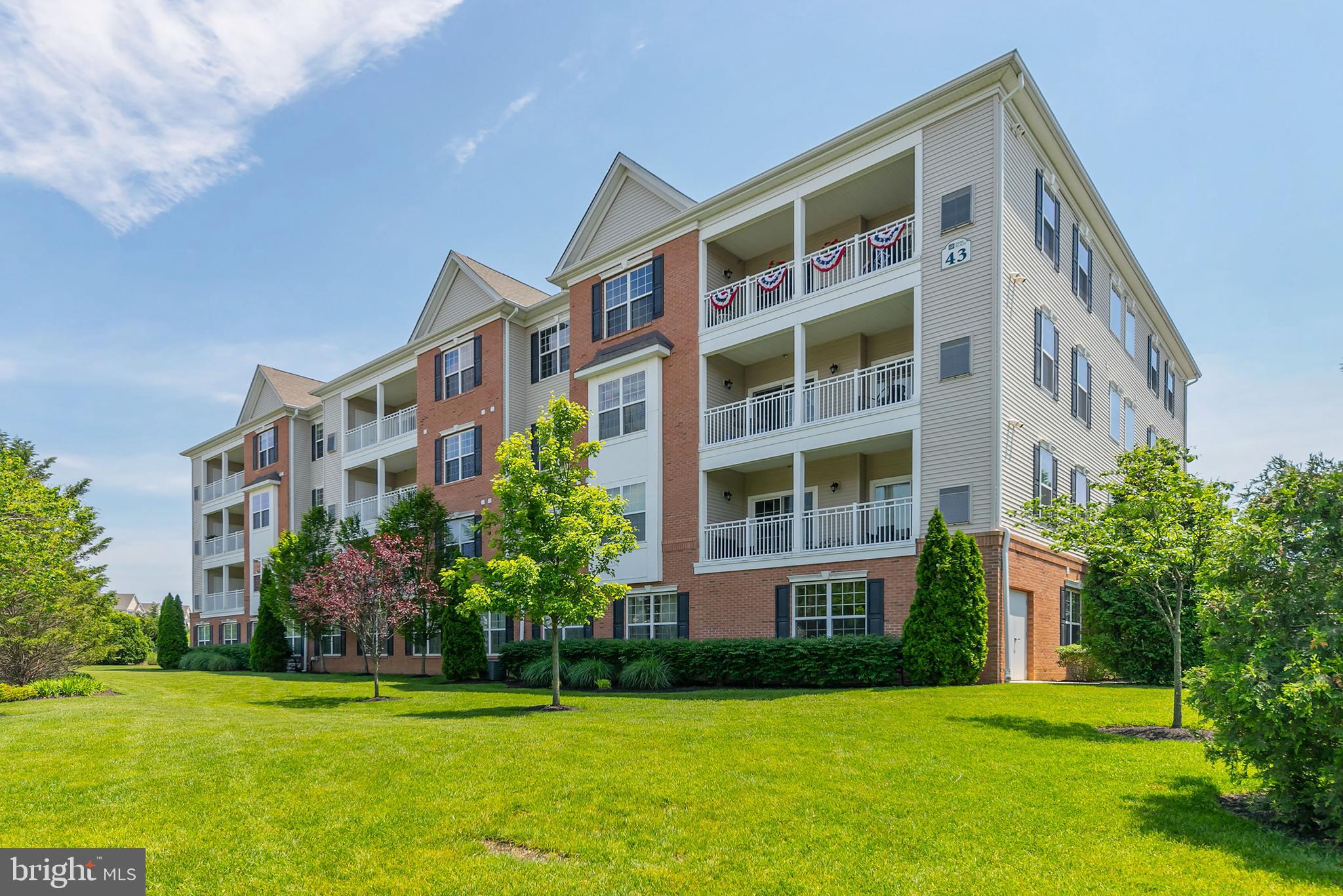 a front view of building with yard