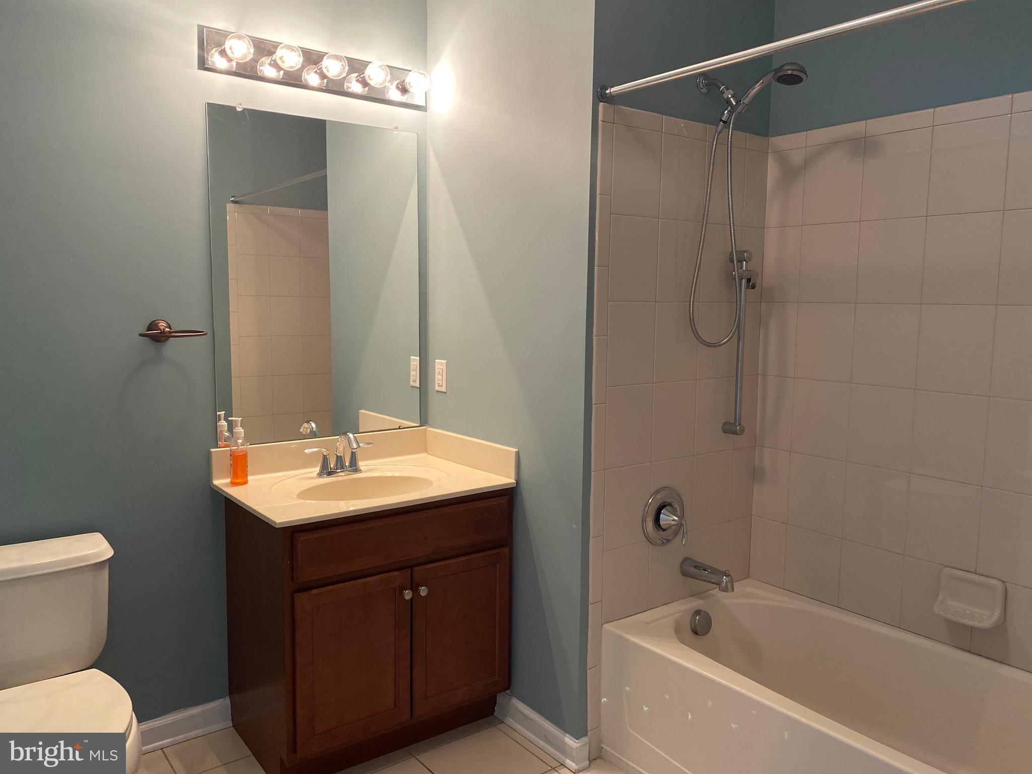 4333 Champions Run Cherry Hill, NJ 08002 - Photo 11 of 14 a bathroom with a sink toilet a shower and a mirror