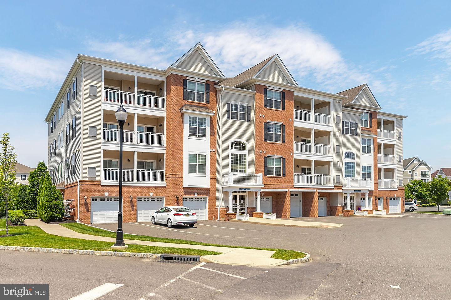 4333 Champions Run Cherry Hill, NJ 08002 - Photo 2 of 14 a front view of residential houses and street