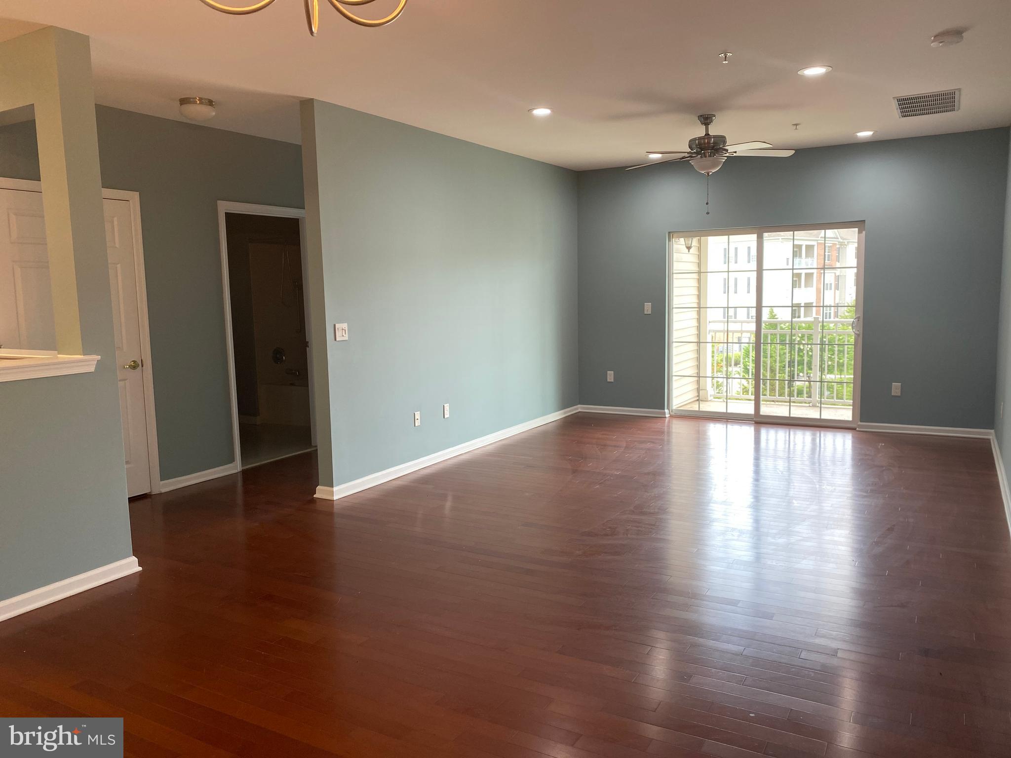 4333 Champions Run Cherry Hill, NJ 08002 - Photo 3 of 14 an empty room with wooden floor and a window