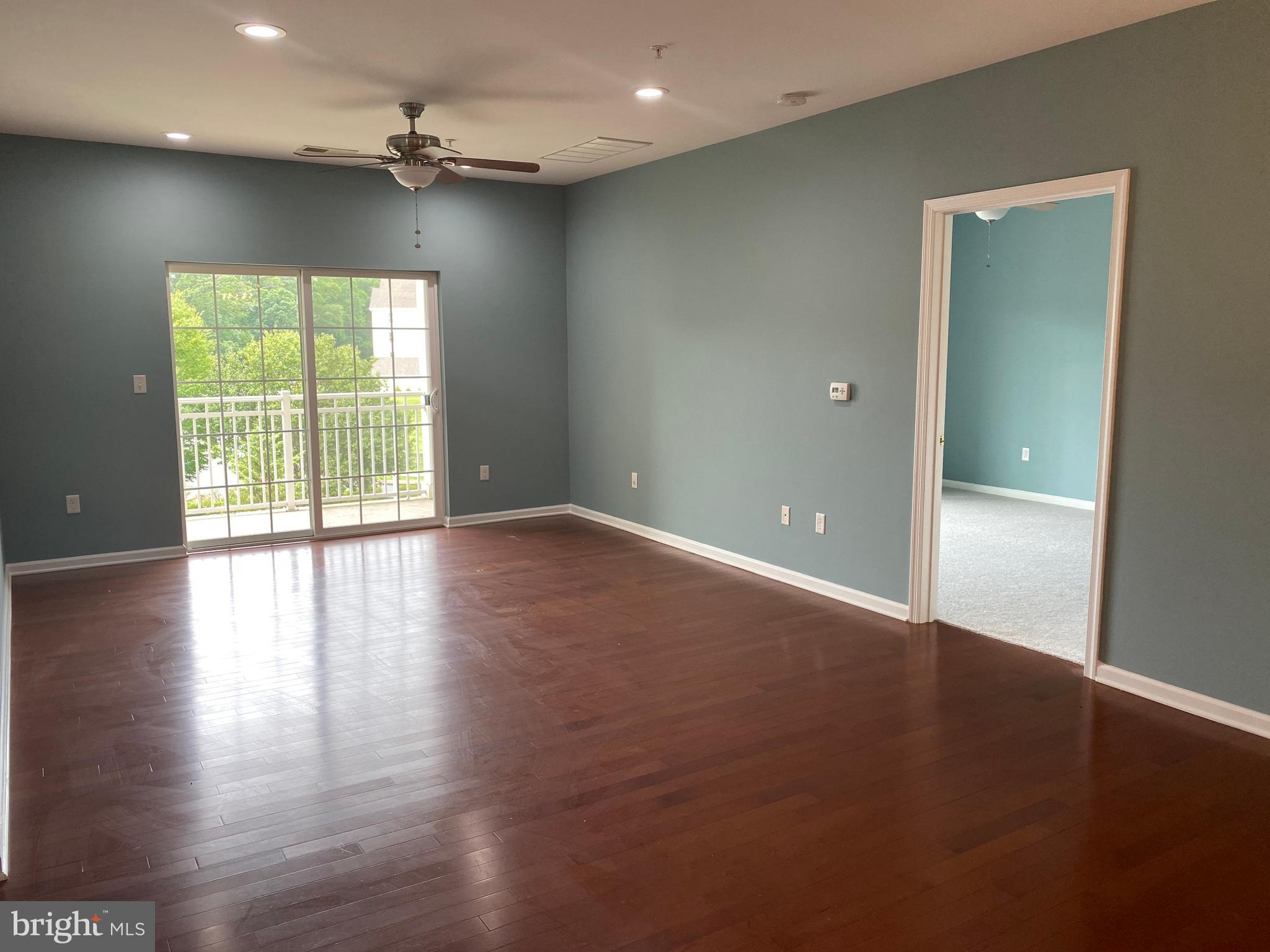 4333 Champions Run Cherry Hill, NJ 08002 - Photo 5 of 14 an empty room with wooden floor and windows