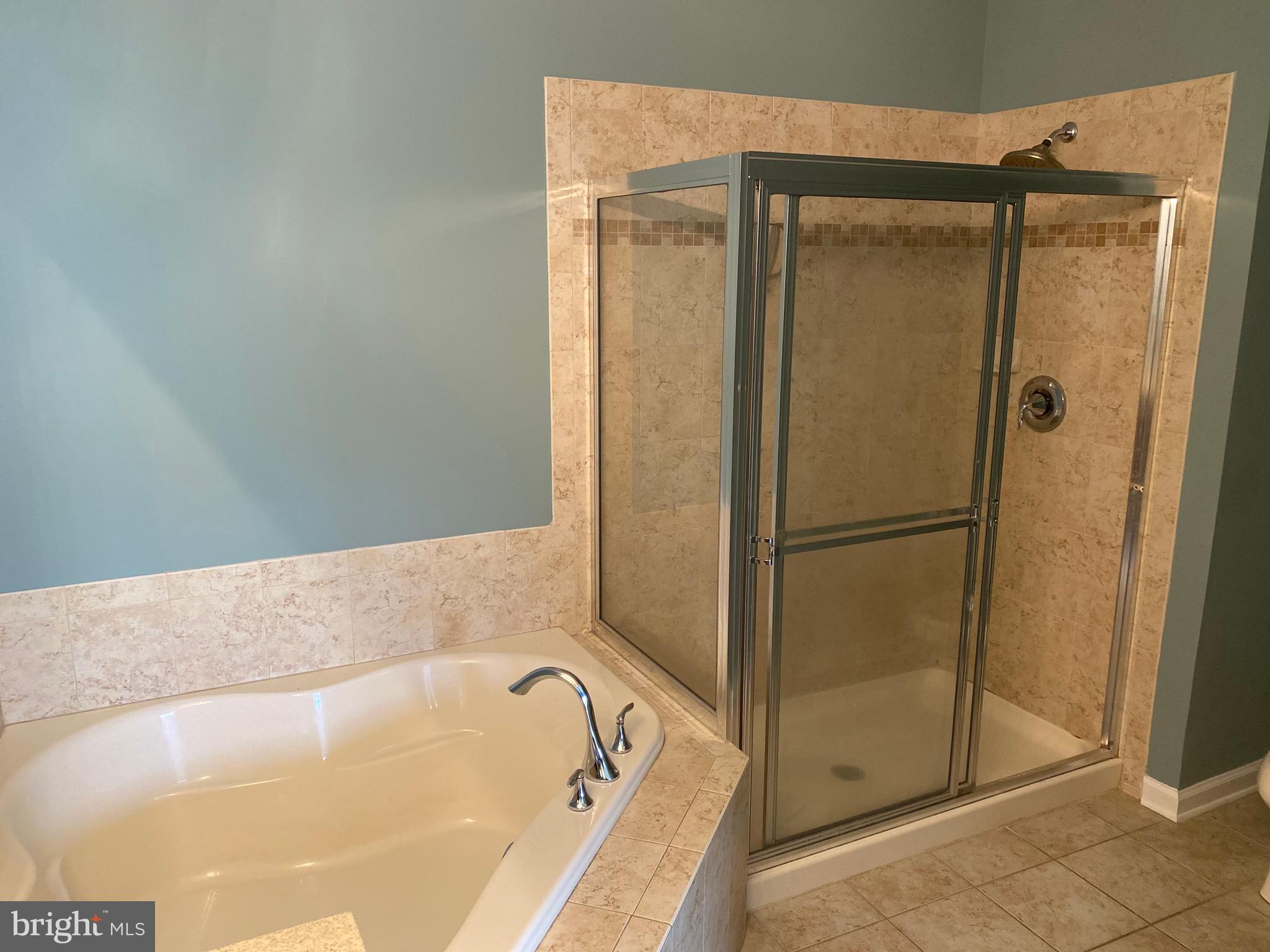 4333 Champions Run Cherry Hill, NJ 08002 - Photo 9 of 14 a bathroom with a tub and a shower