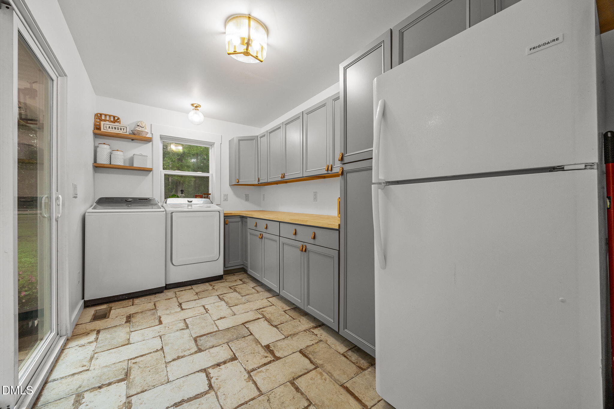 320 Dewitt Smith Road Pittsboro, NC 27312 - Photo 14 of 40 a kitchen with white cabinets and white appliances