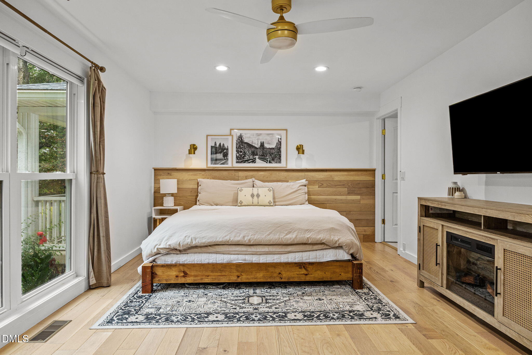 320 Dewitt Smith Road Pittsboro, NC 27312 - Photo 18 of 40 a bedroom with a bed and a flat screen tv