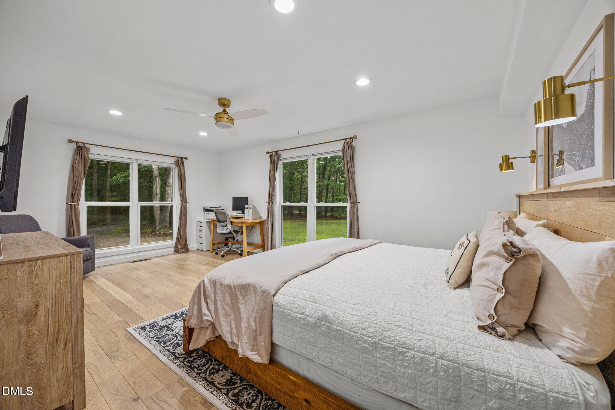 320 Dewitt Smith Road Pittsboro, NC 27312 - Photo 19 of 40 a bed sitting in a bedroom next to a window