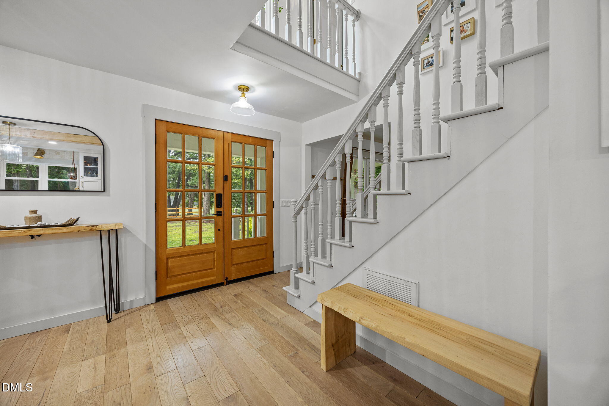 320 Dewitt Smith Road Pittsboro, NC 27312 - Photo 3 of 40 a view of entryway and hall with wooden floor