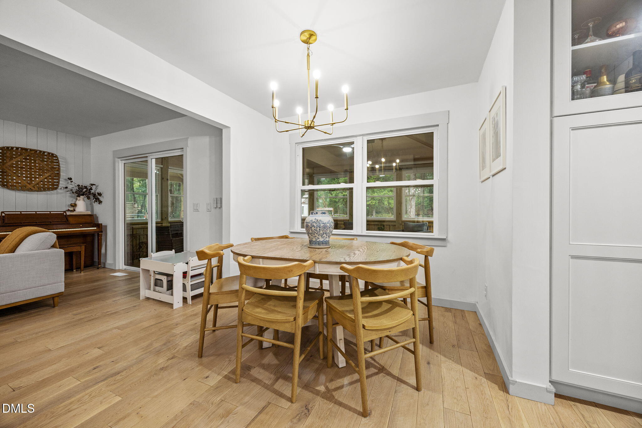 320 Dewitt Smith Road Pittsboro, NC 27312 - Photo 6 of 40 a dining room with furniture a chandelier and wooden floor