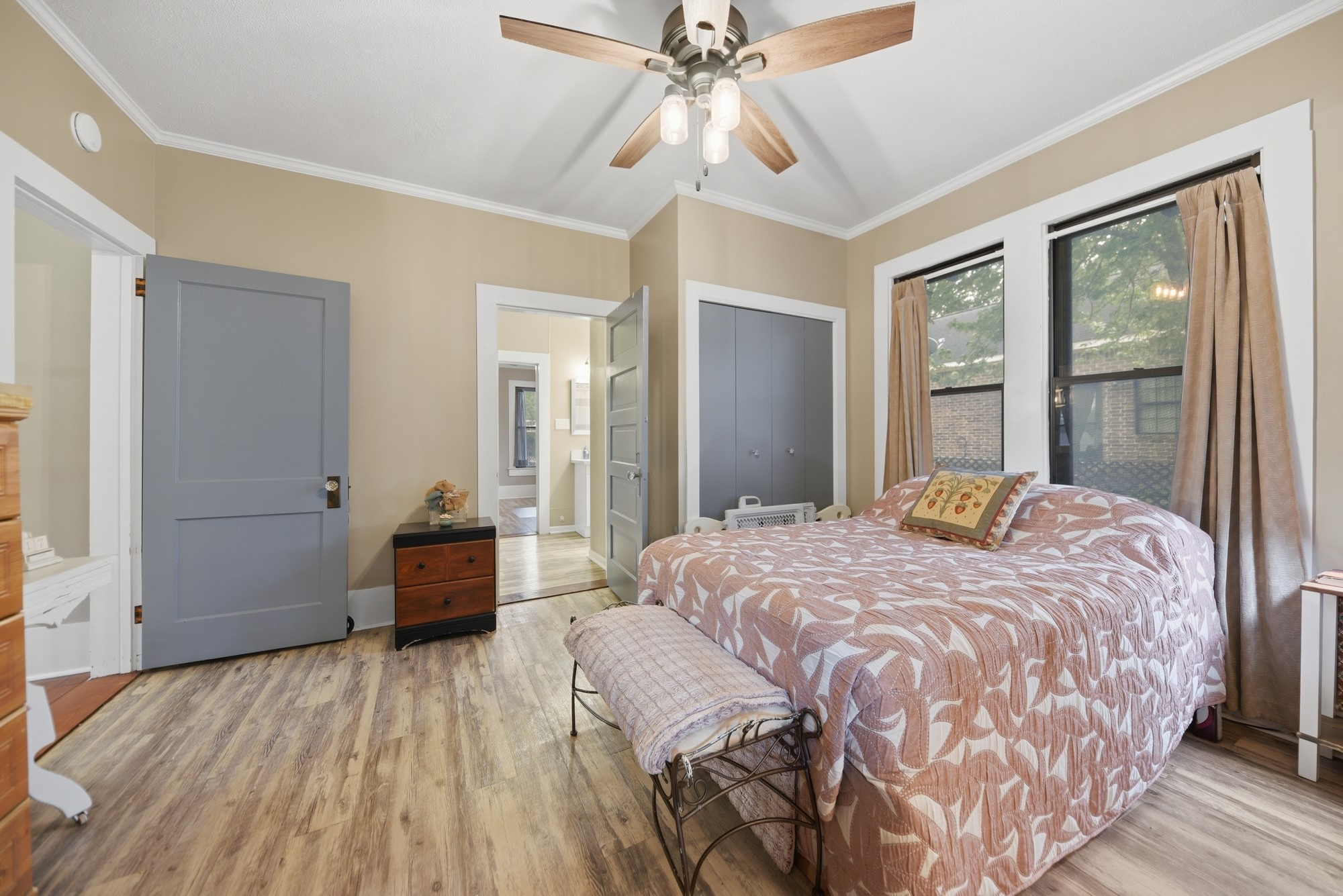 1501 South Austin Street Brenham, TX 77833 - Photo 13 of 36 a bedroom with a bed and a chandelier