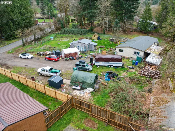 an aerial view of a house with garden space and street view