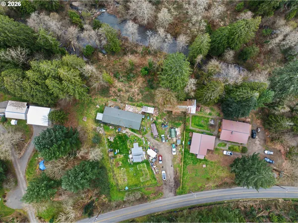 an aerial view of a house with a yard