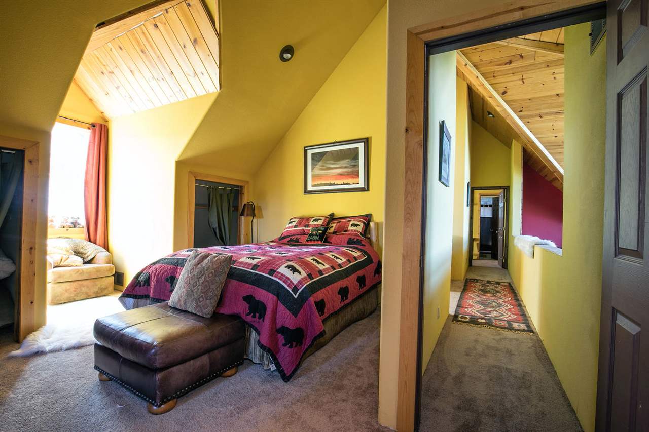 21040 Highway 89 Calpine, CA 96124 - Photo 11 of 21 a bedroom with a bed and a couch