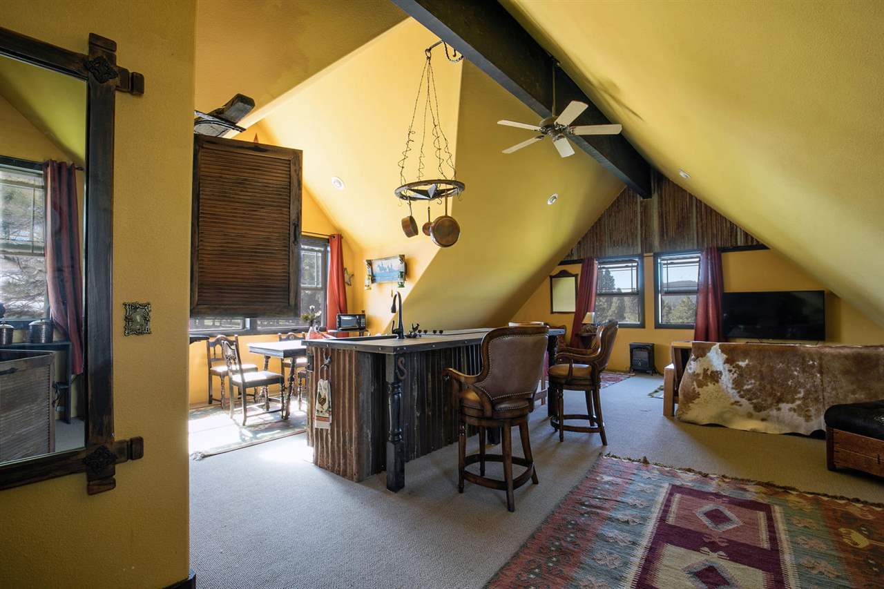 21040 Highway 89 Calpine, CA 96124 - Photo 13 of 21 a living room with furniture and a flat screen tv