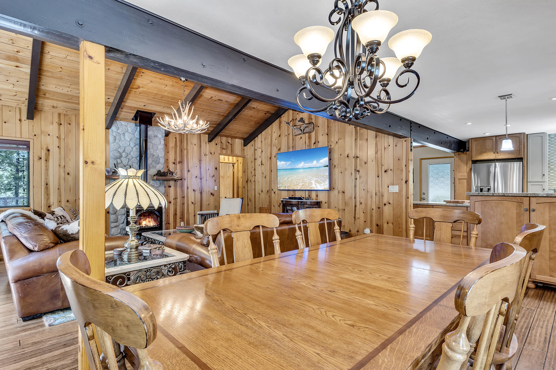 54580 Reed Lane Idyllwild, CA 92549 - Photo 41 of 101 a view of a dining room with furniture a chandelier and large windows