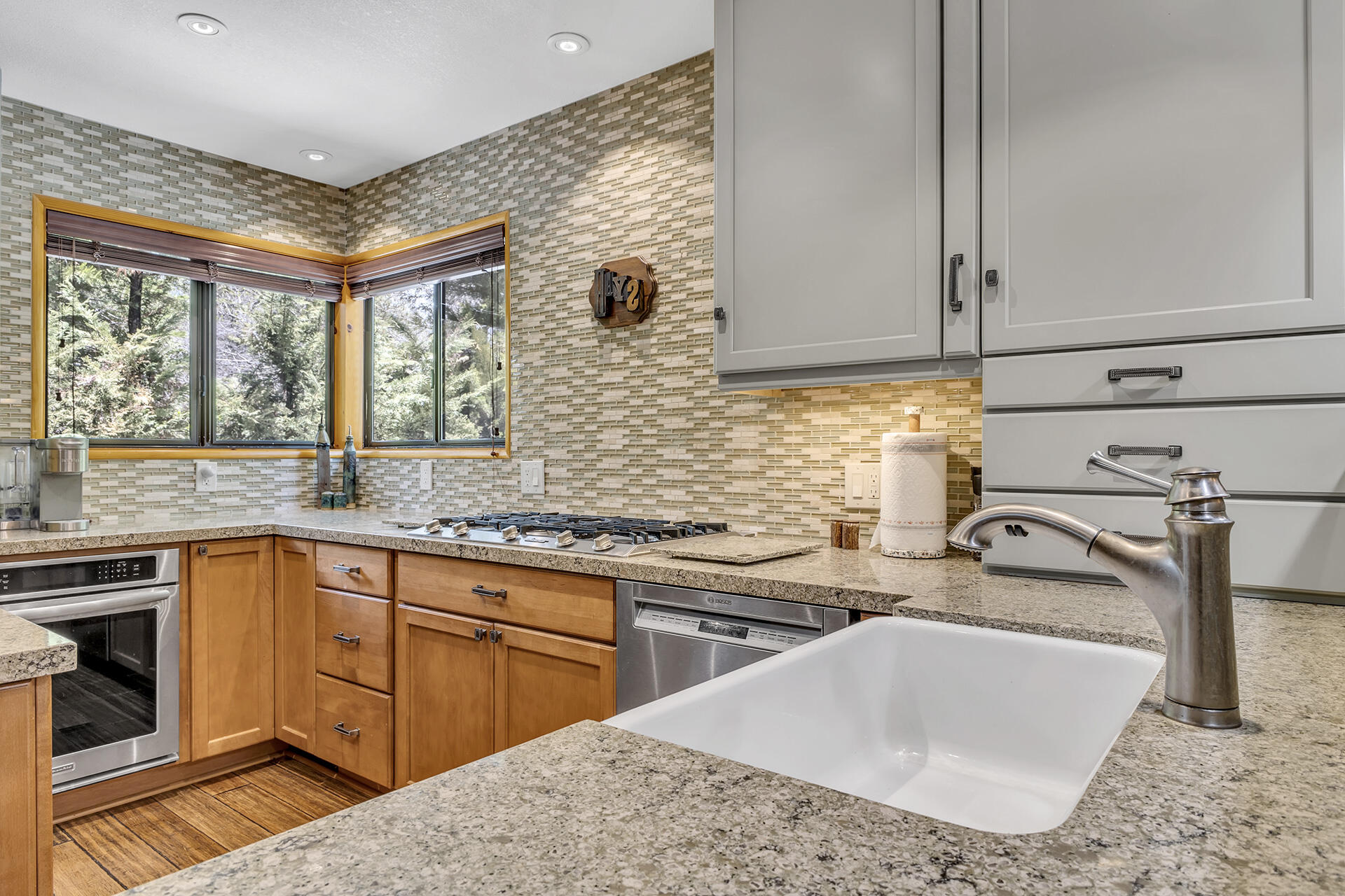 54580 Reed Lane Idyllwild, CA 92549 - Photo 44 of 101 a kitchen with stainless steel appliances granite countertop a sink a stove and a wooden cabinets