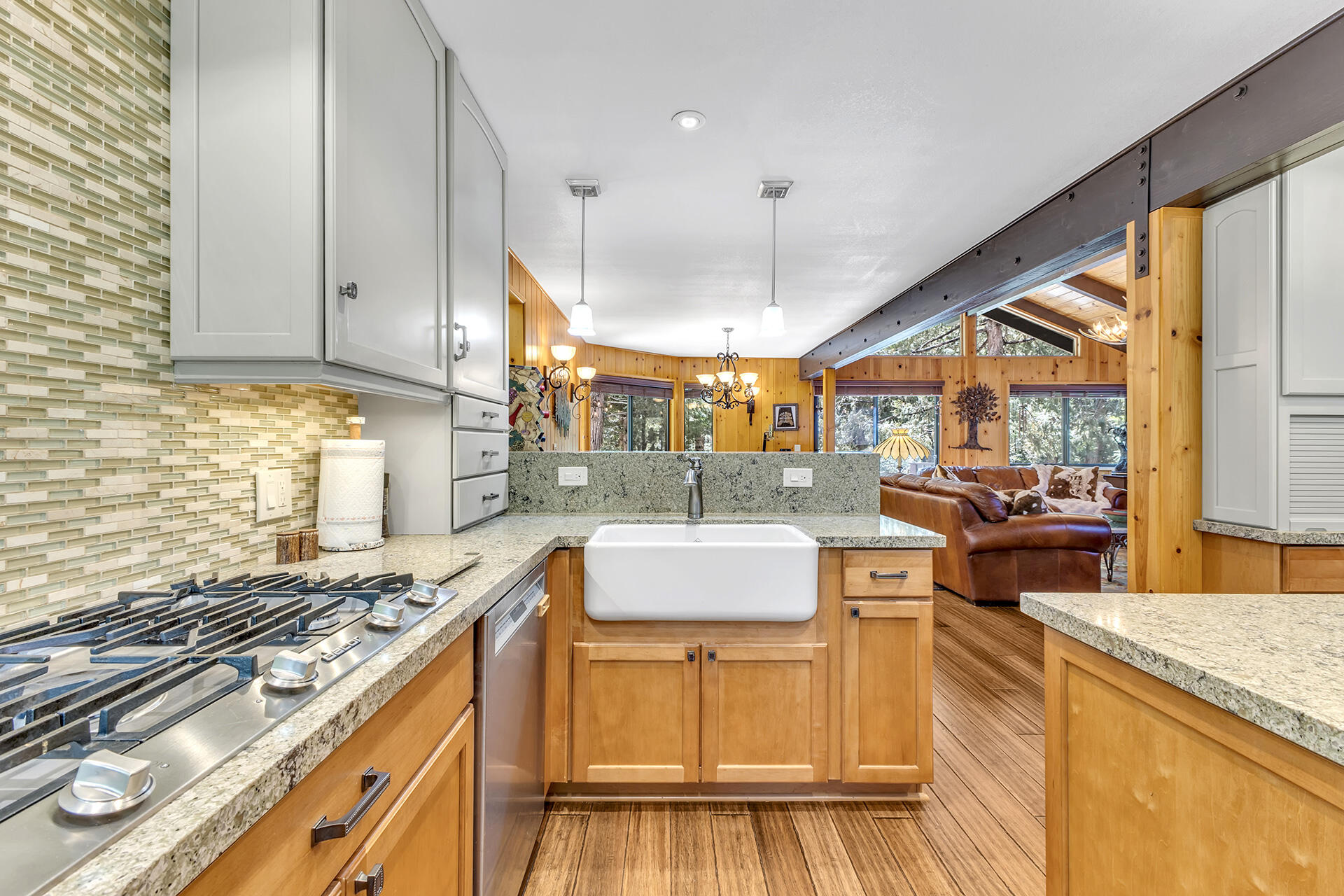 54580 Reed Lane Idyllwild, CA 92549 - Photo 46 of 101 a kitchen with stainless steel appliances granite countertop a stove and a view of living room