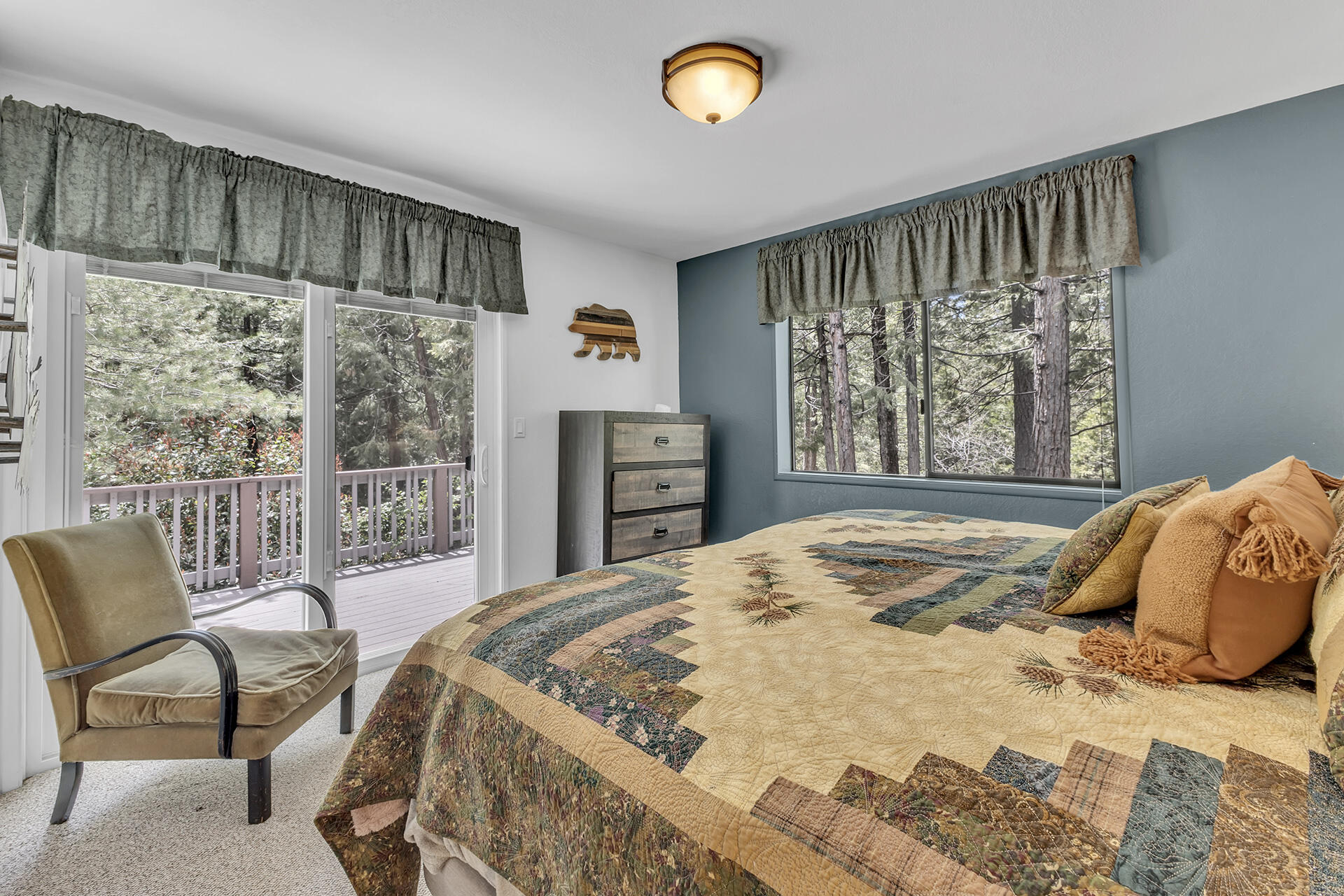 54580 Reed Lane Idyllwild, CA 92549 - Photo 55 of 101 a bedroom with a bed and a large window with chair and table