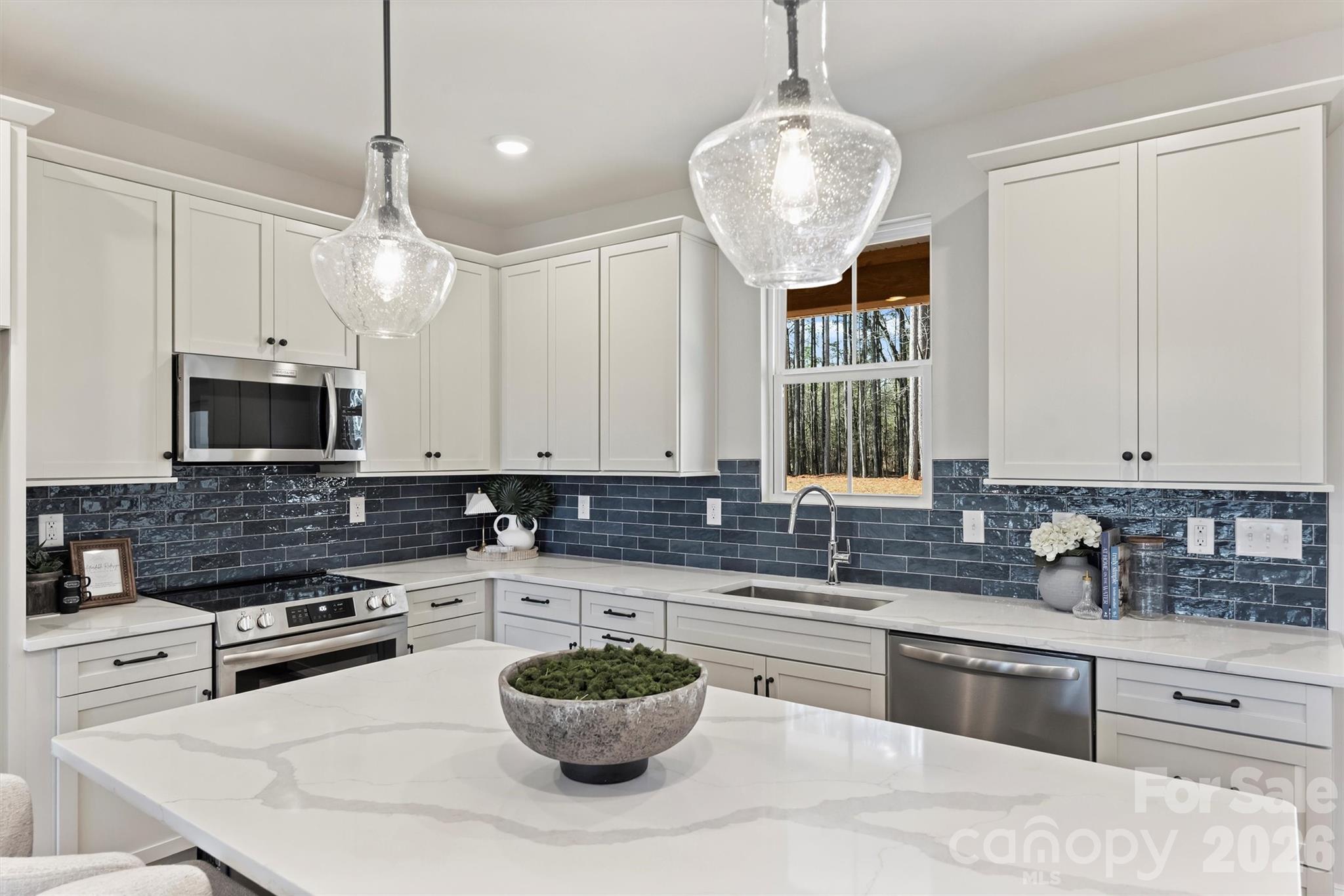 2295 Lee Lawing Road Lincolnton, NC 28092 - Photo 15 of 43 a kitchen with a stove a sink and a refrigerator