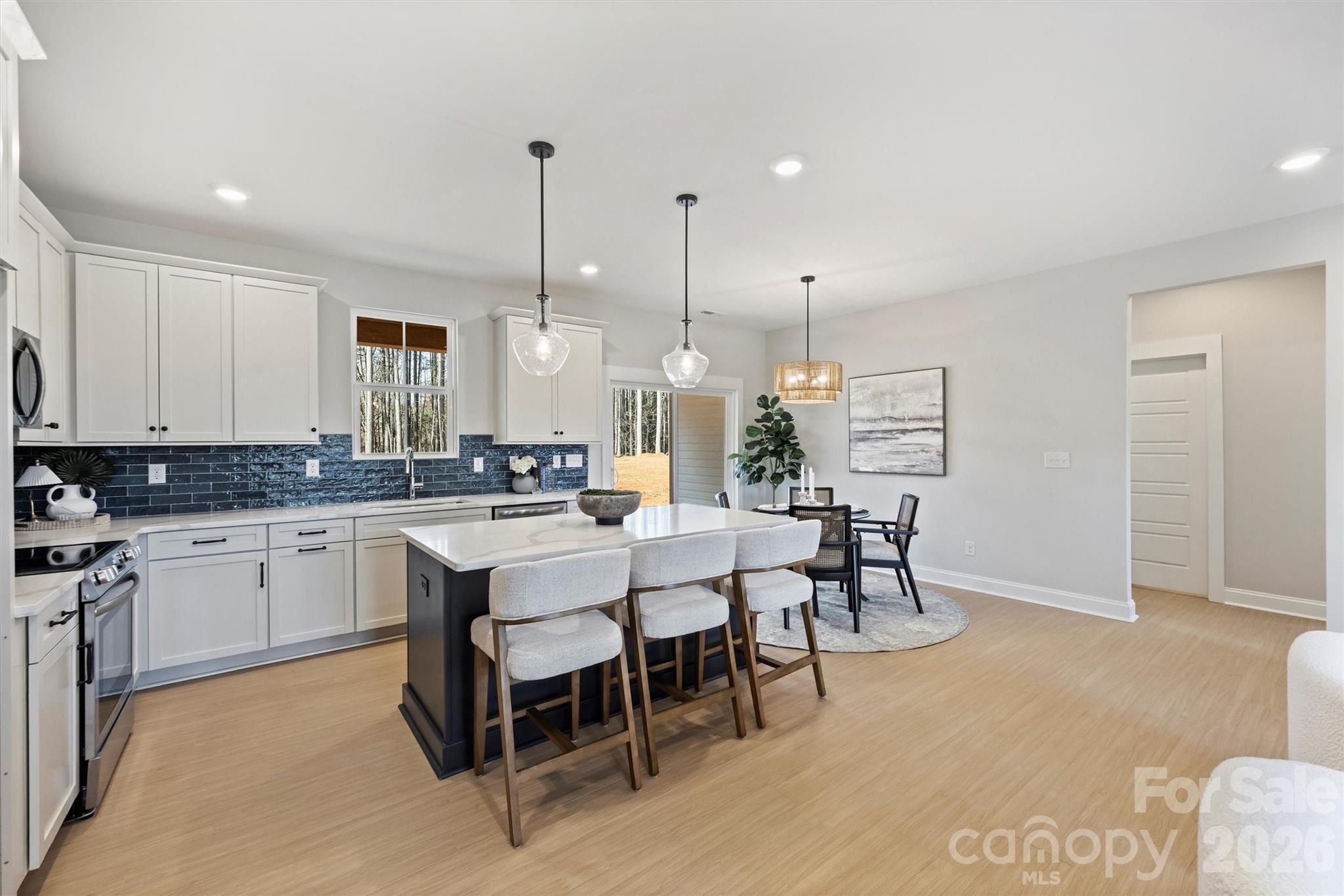 2295 Lee Lawing Road Lincolnton, NC 28092 - Photo 16 of 43 a large kitchen with a table and chairs
