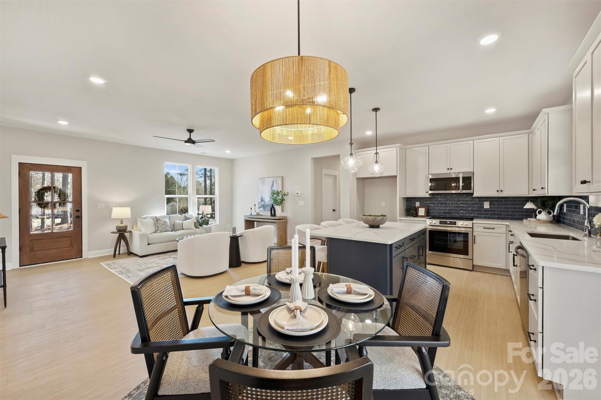 2295 Lee Lawing Road Lincolnton, NC 28092 - Photo 21 of 43 a kitchen with a dining table and chairs