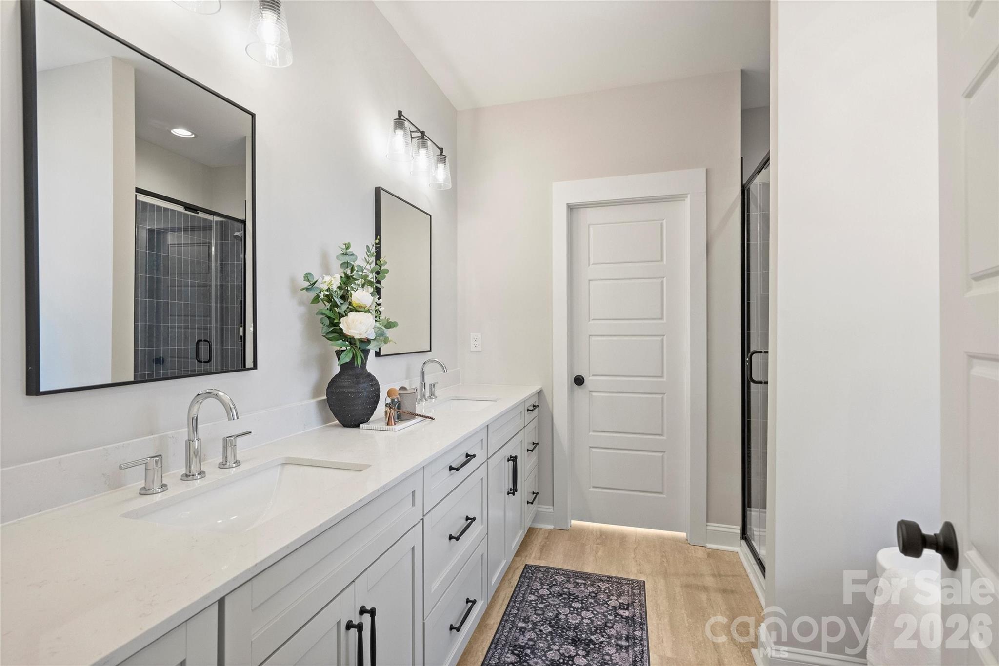 2295 Lee Lawing Road Lincolnton, NC 28092 - Photo 24 of 43 a bathroom with a double vanity sink and a mirror