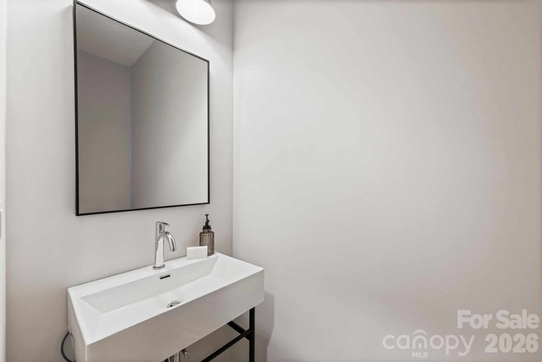 2295 Lee Lawing Road Lincolnton, NC 28092 - Photo 31 of 43 a bathroom with a sink and a mirror