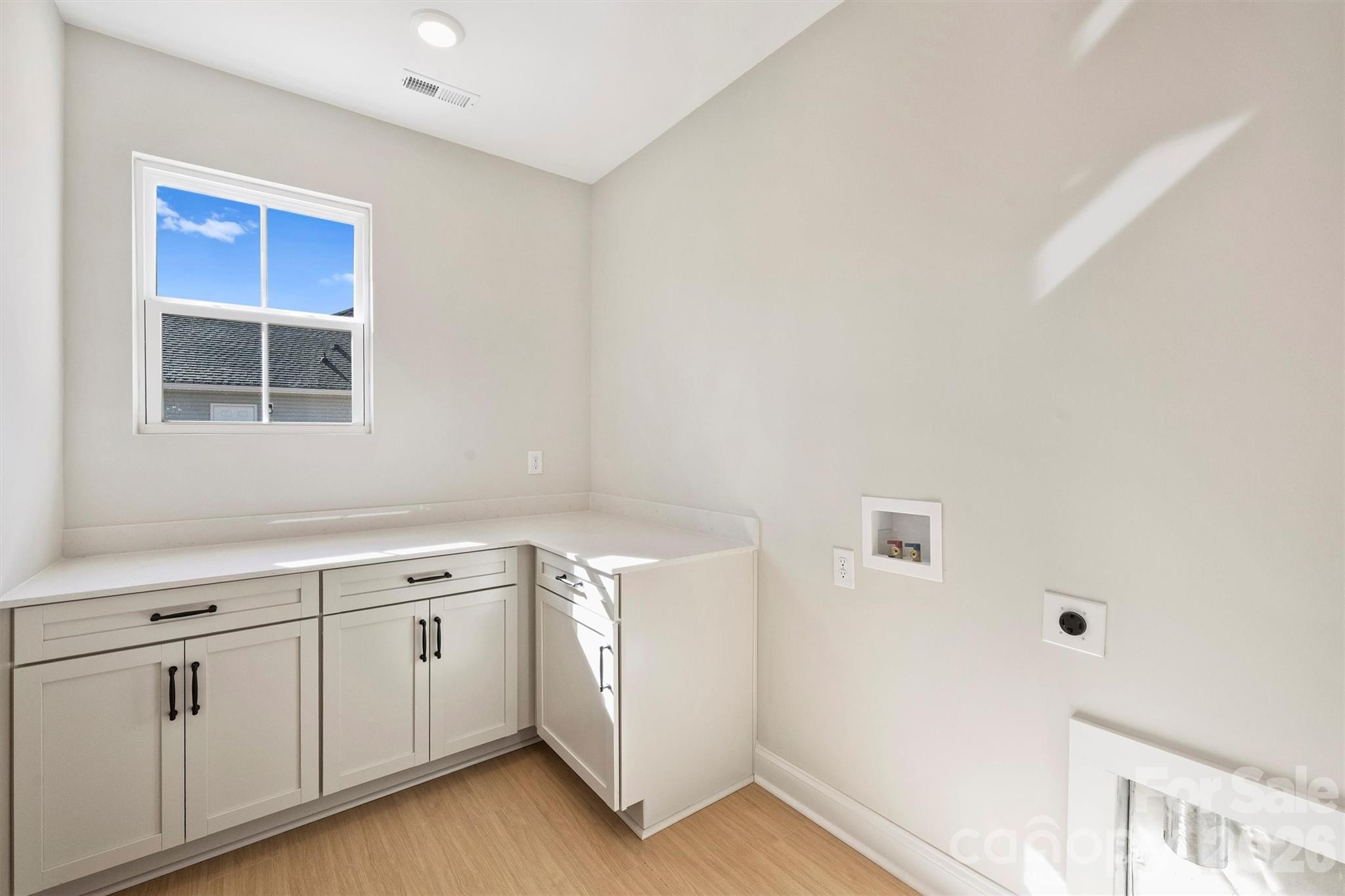 2295 Lee Lawing Road Lincolnton, NC 28092 - Photo 36 of 43 a utility room with cabinets washer and dryer