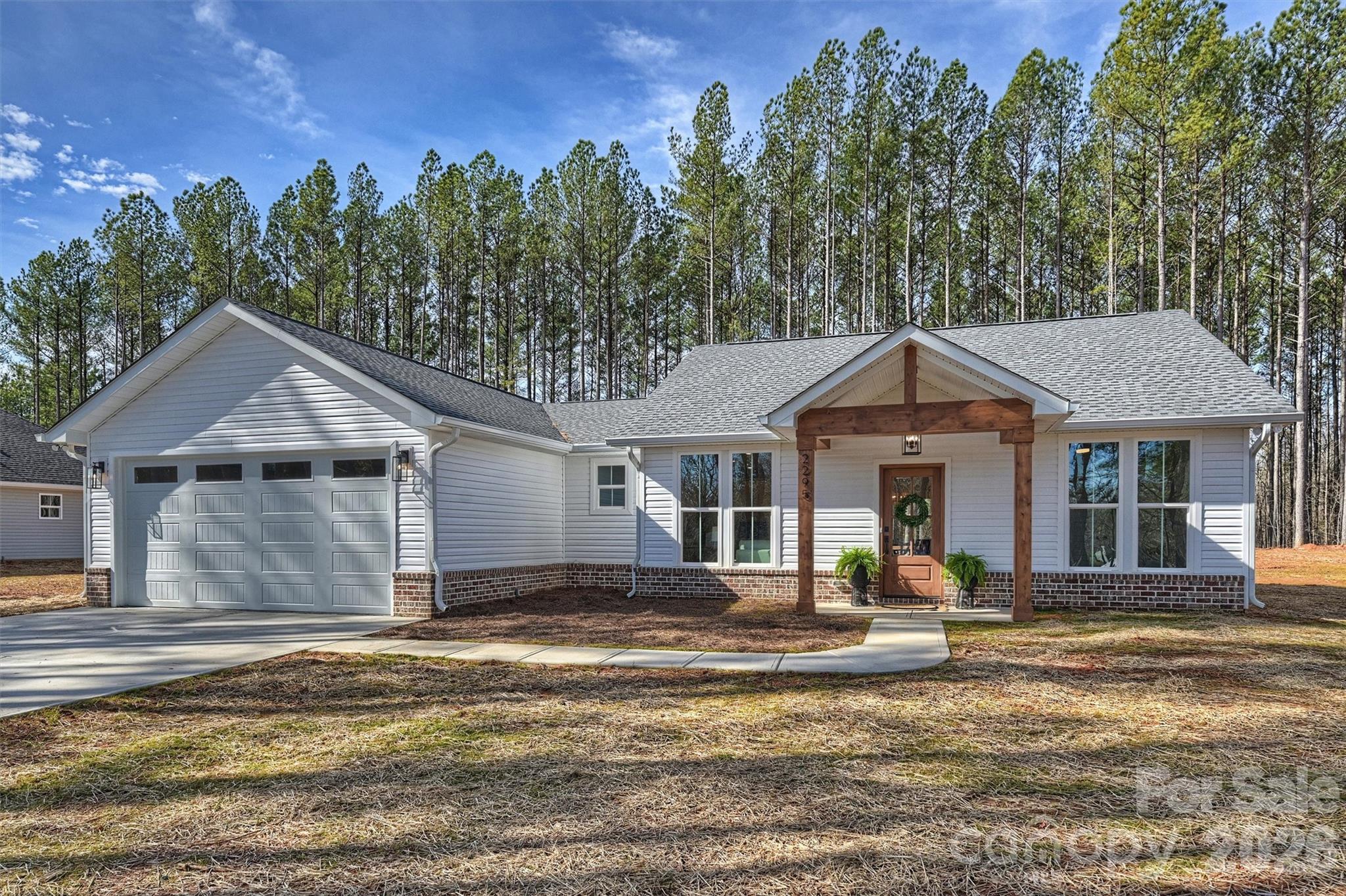 2295 Lee Lawing Road Lincolnton, NC 28092 - Photo 43 of 43 a front view of a house with a yard