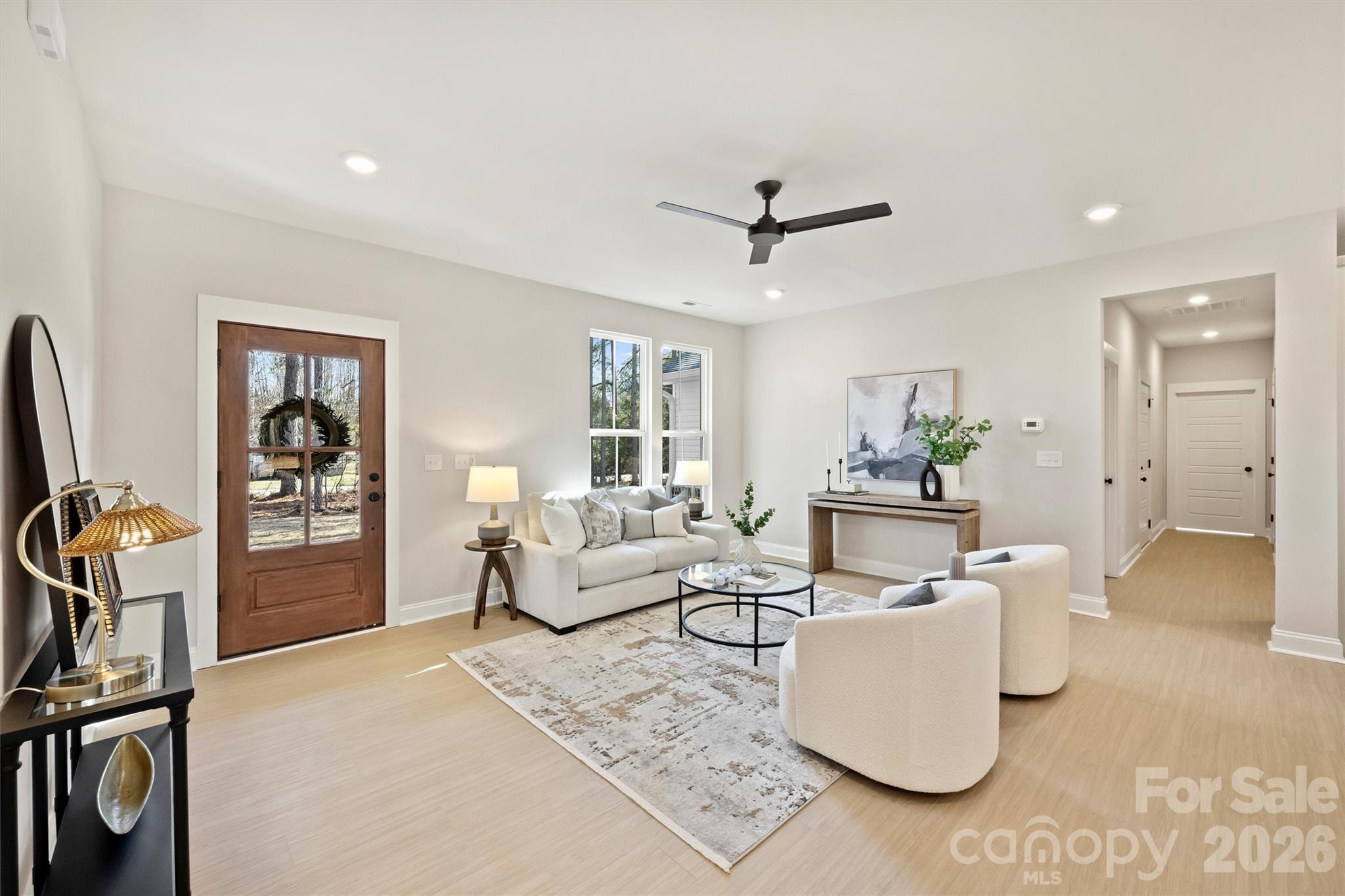 2295 Lee Lawing Road Lincolnton, NC 28092 - Photo 6 of 43 a living room with furniture a flat screen tv and a window