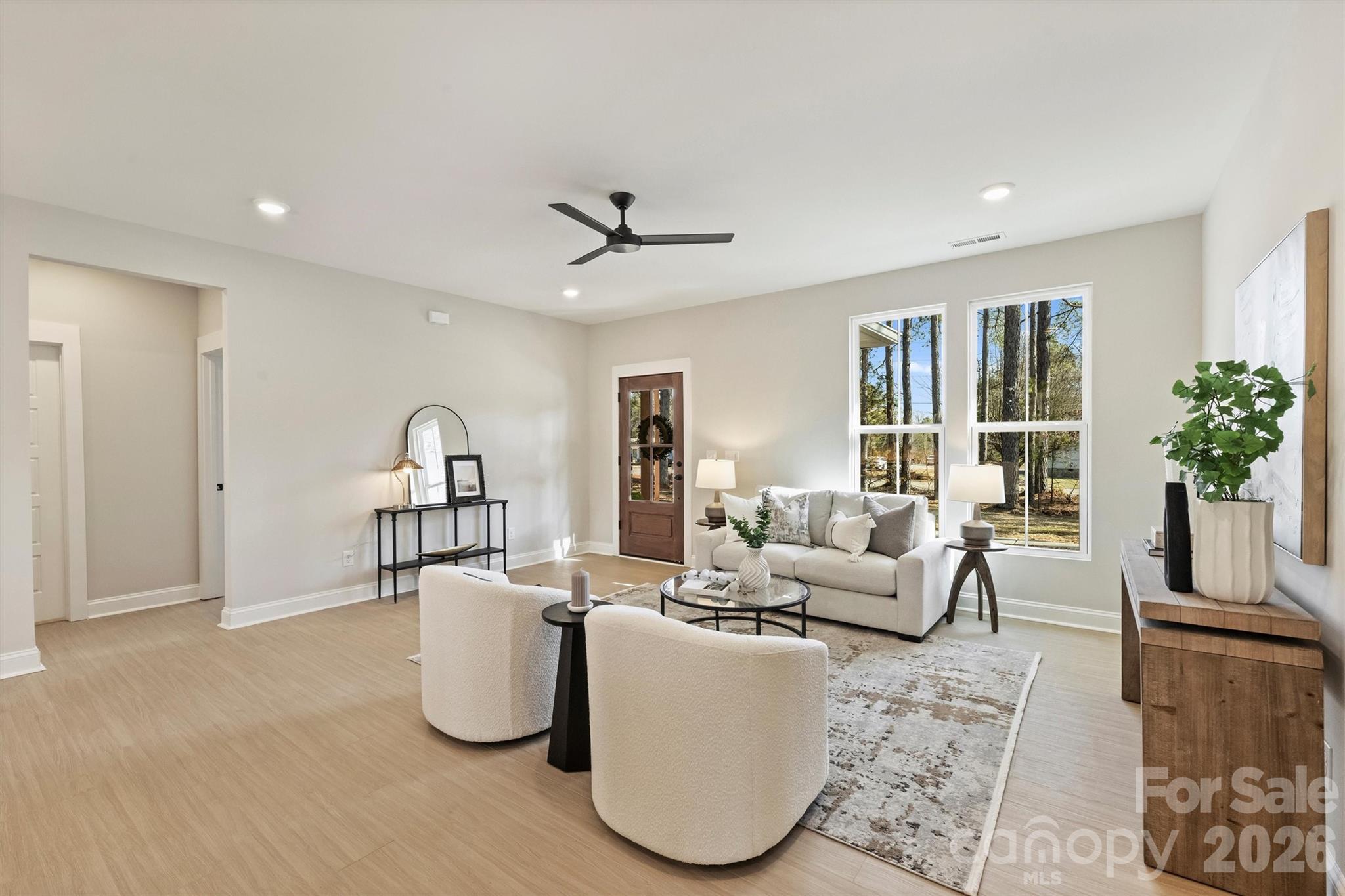 2295 Lee Lawing Road Lincolnton, NC 28092 - Photo 9 of 43 a living room with furniture and a potted plant