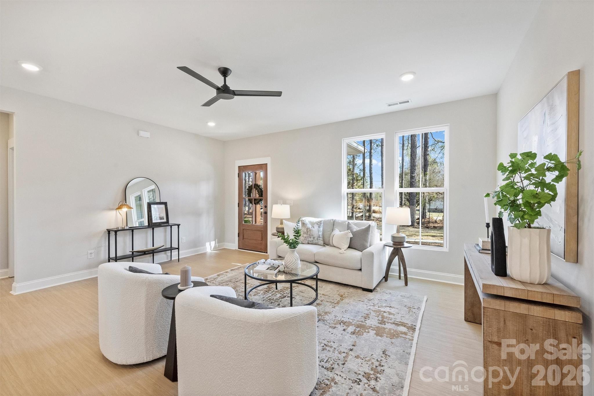 2295 Lee Lawing Road Lincolnton, NC 28092 - Photo 10 of 43 a living room with furniture and a potted plant