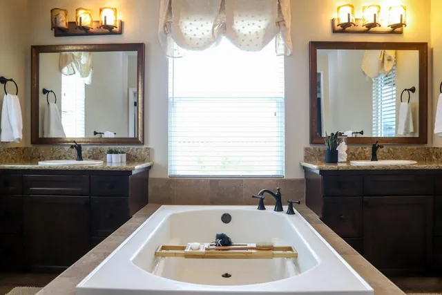 a bathroom with a toilet and a glass shower door