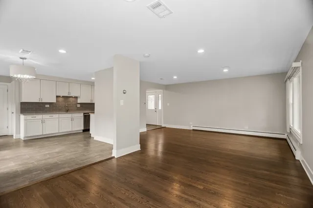 a view of kitchen with wooden floor