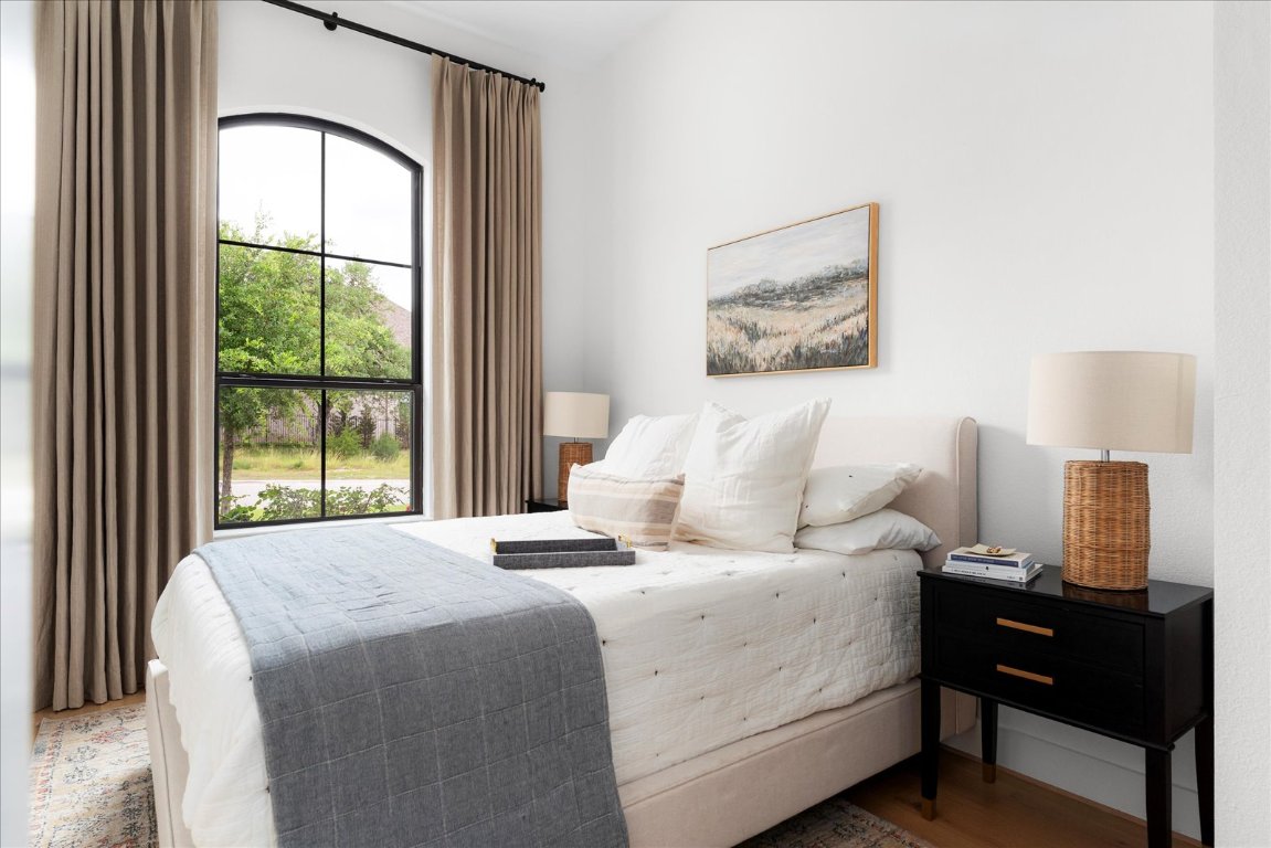 482 Running Bird Road Austin, TX 78737 - Photo 14 of 38 Bright and inviting bedroom with custom window treatments and lovely views of the front yard.