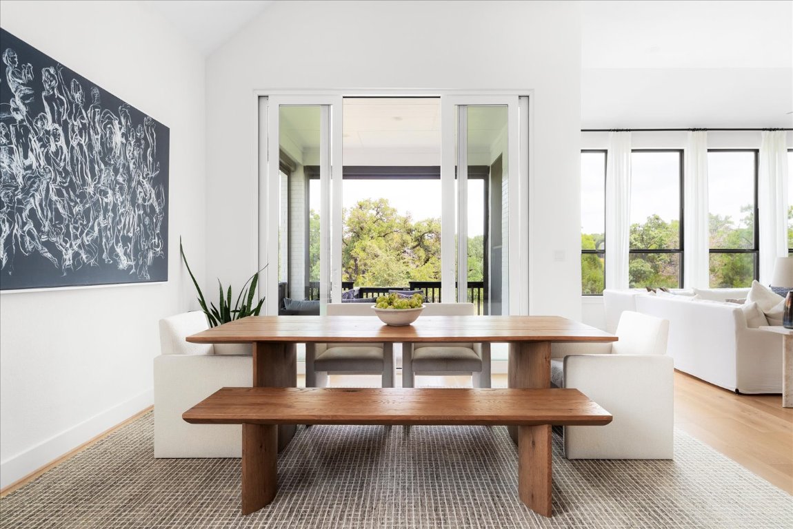 482 Running Bird Road Austin, TX 78737 - Photo 16 of 38 Gather, celebrate, and entertain in this generous dining room with seamless indoor-outdoor access.