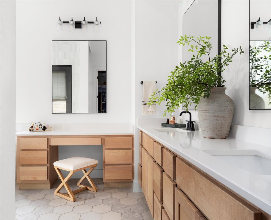 482 Running Bird Road Austin, TX 78737 - Photo 25 of 38 Spacious and stylish, this primary bath boasts three vanities and upgraded mirrors, perfect for morning routines with room to spare.